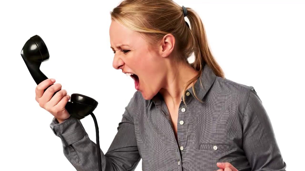 unhappy-angry-call-center-worker-frustrated-with-workload-stock-photo